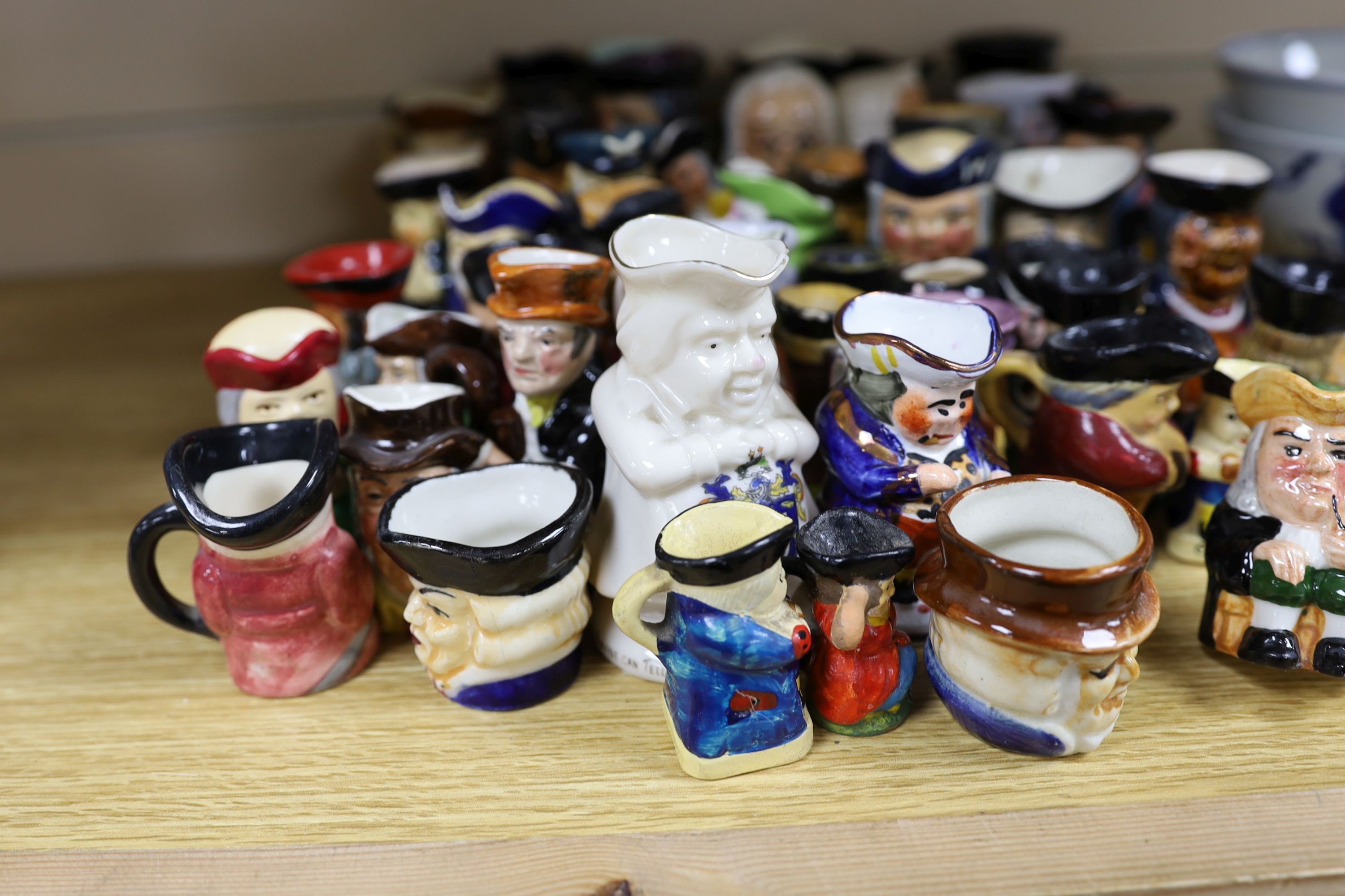 Fifty two miniature Toby jugs